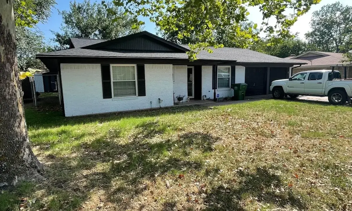 Professional roofing crew working on a residential roof in Bloomingdale
